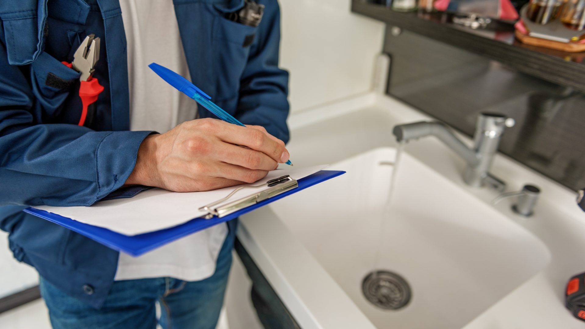 Inspector working next to a sink.